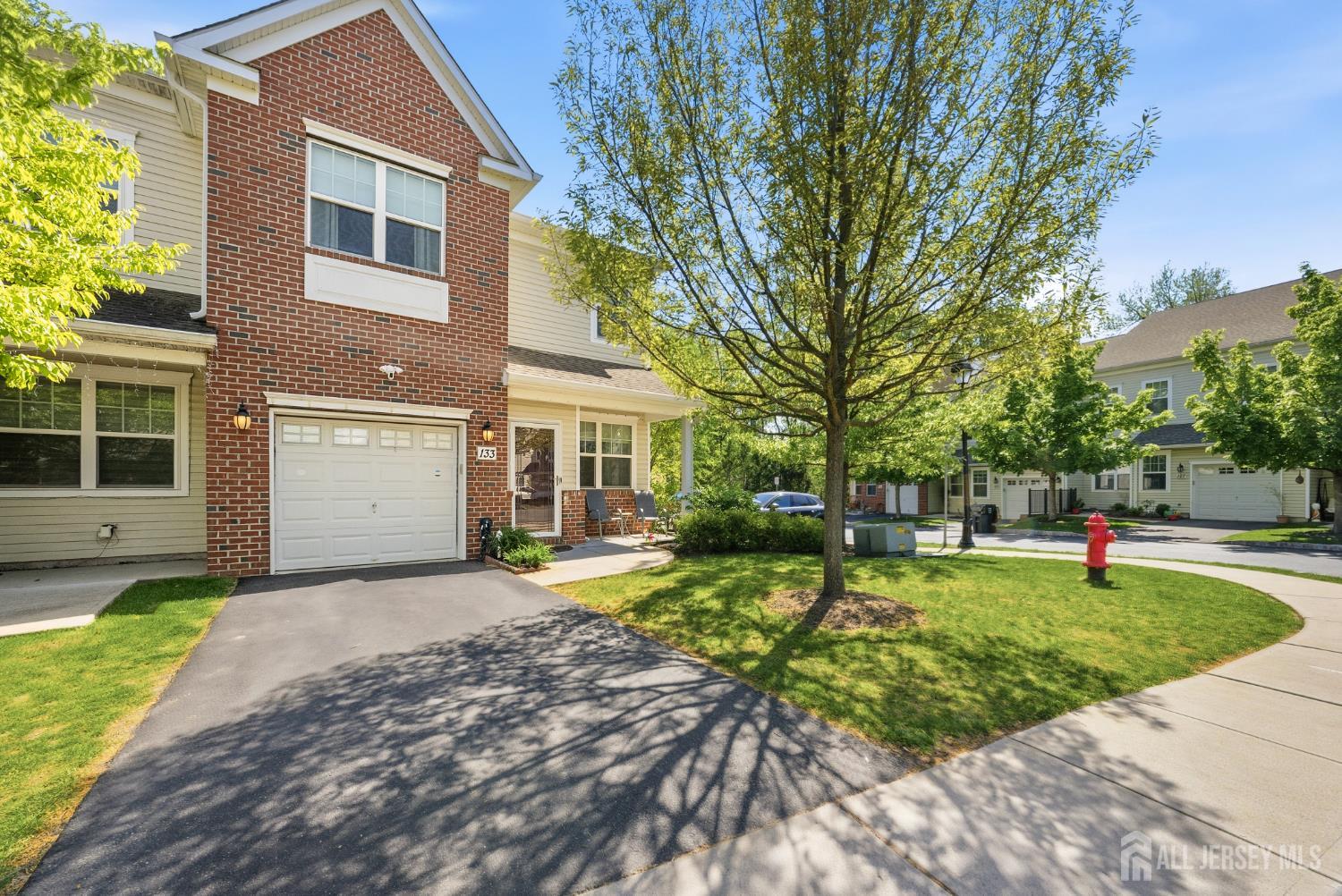 133 Savoth Lane Colonia, NJ 07067 - Photo 1 of 21 a front view of a house with a yard and trees