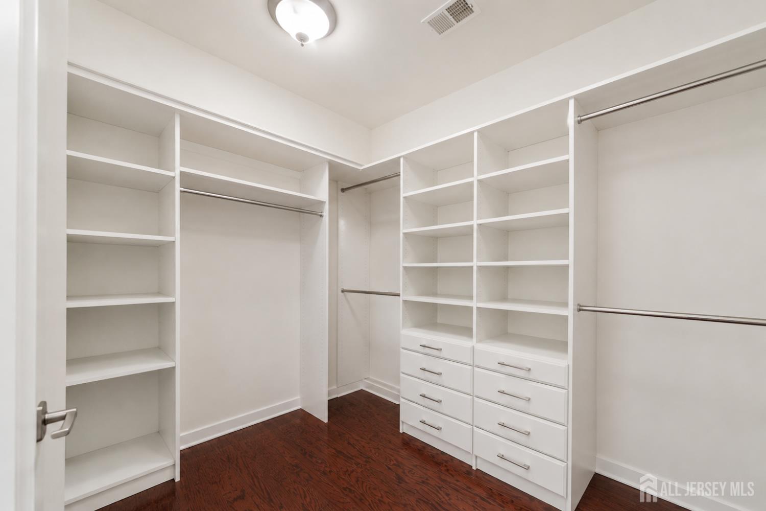 133 Savoth Lane Colonia, NJ 07067 - Photo 13 of 21 a room with walk in closet and wooden floor