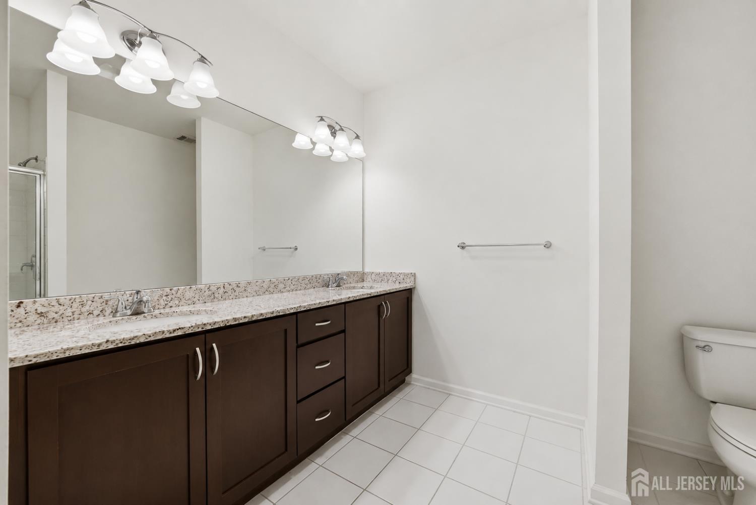 133 Savoth Lane Colonia, NJ 07067 - Photo 14 of 21 a bathroom with a sink vanity and a mirror