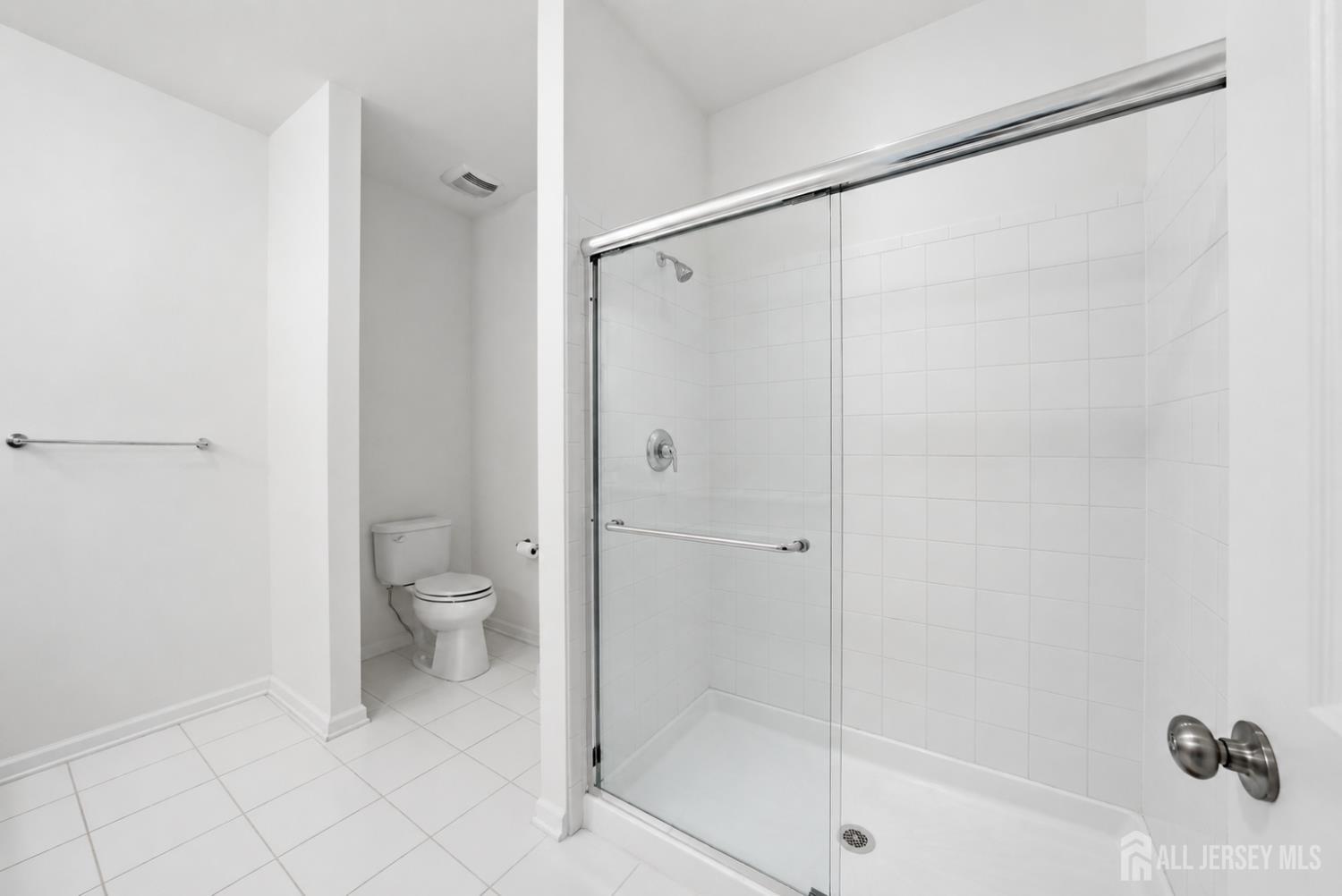 133 Savoth Lane Colonia, NJ 07067 - Photo 15 of 21 a bathroom with a shower and a toilet