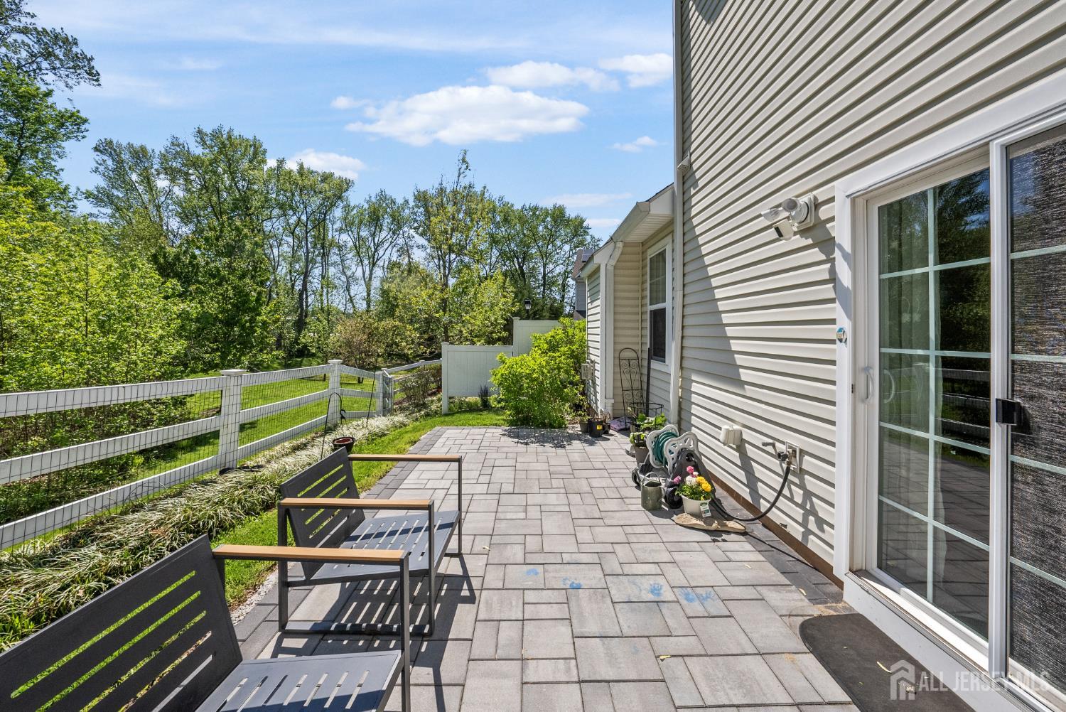 133 Savoth Lane Colonia, NJ 07067 - Photo 2 of 21 a view of a chairs and tables in the backyard