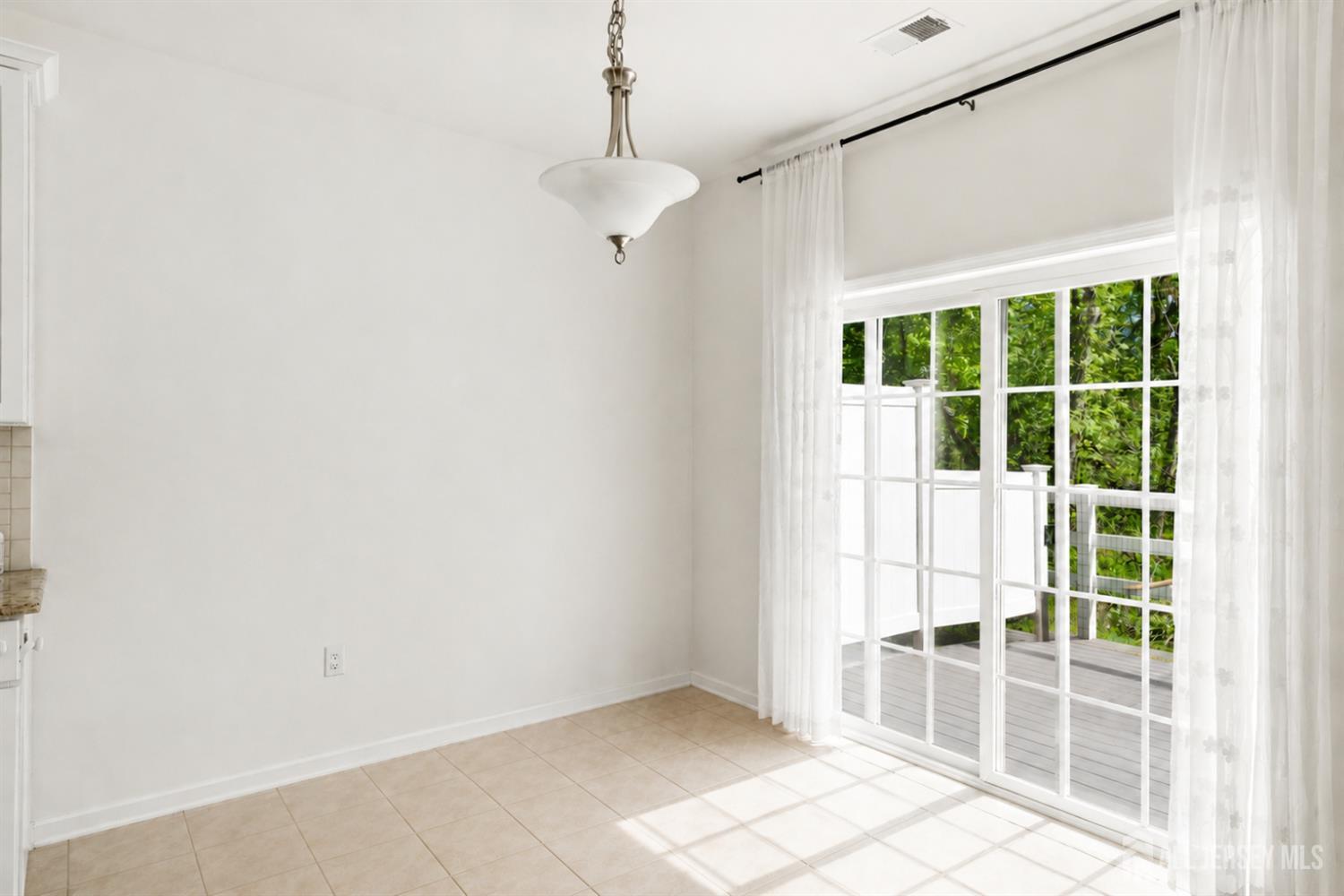 133 Savoth Lane Colonia, NJ 07067 - Photo 6 of 21 a view of empty room with windows