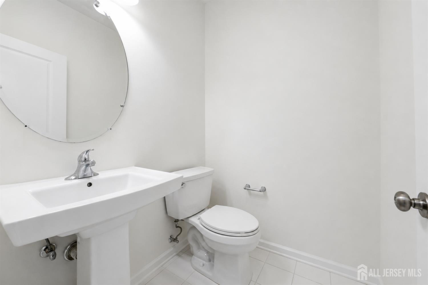 133 Savoth Lane Colonia, NJ 07067 - Photo 7 of 21 a bathroom with a sink mirror and toilet