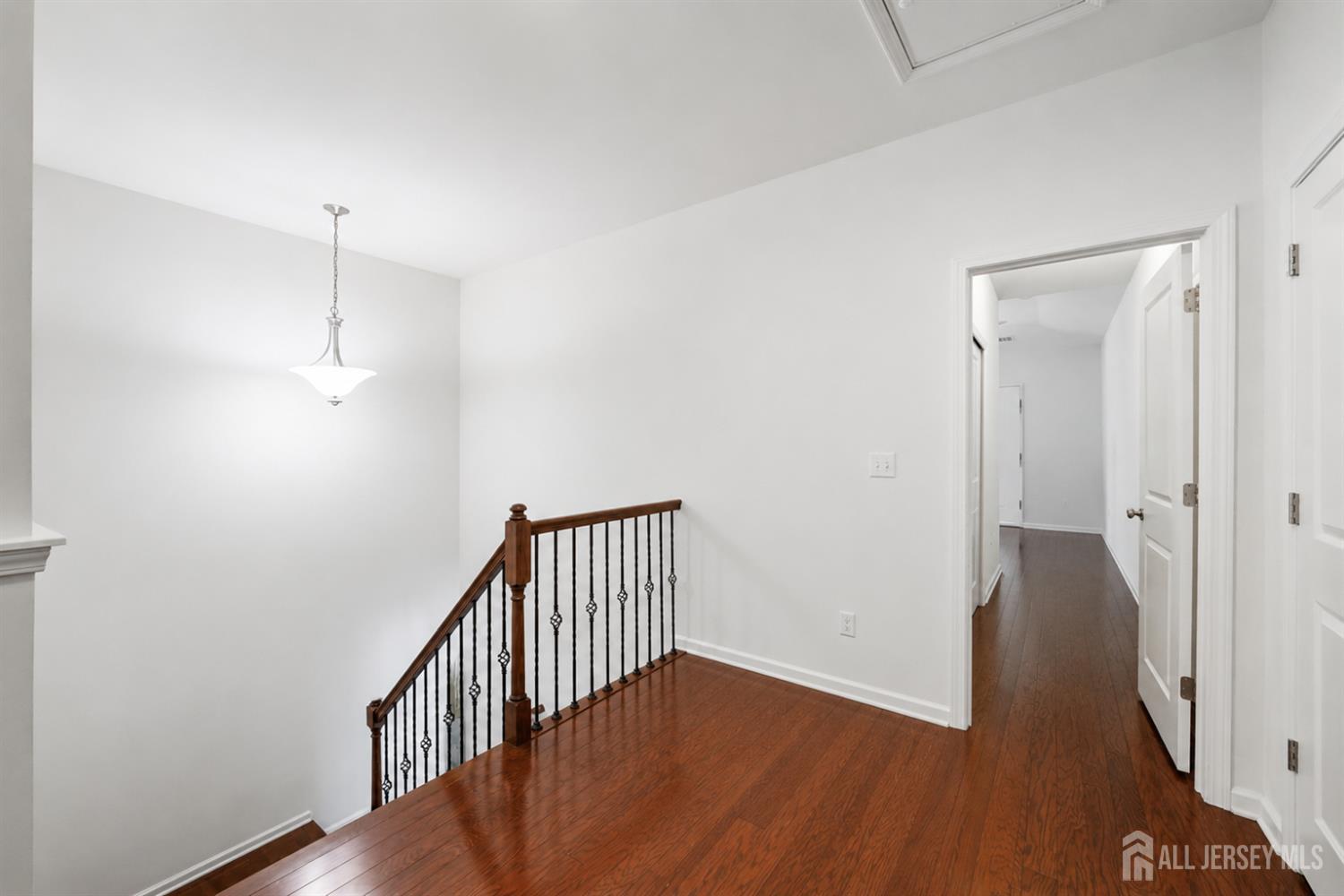 133 Savoth Lane Colonia, NJ 07067 - Photo 9 of 21 wooden floor in an empty room
