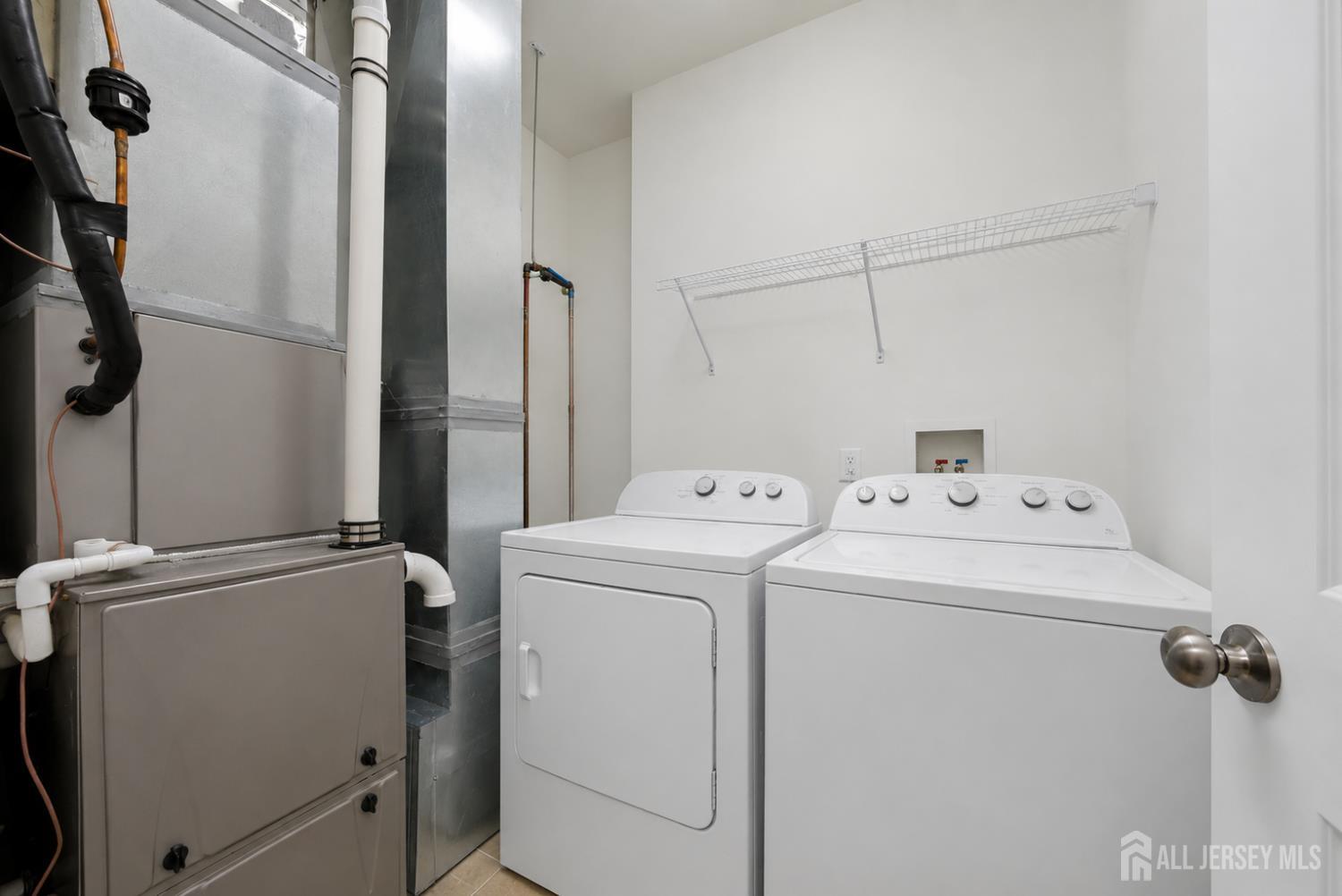 133 Savoth Lane Colonia, NJ 07067 - Photo 10 of 21 a utility room with dryer and washer