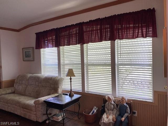 298 Riverwood Road Naples, FL 34114 - Photo 13 of 39 a living room with furniture and a window