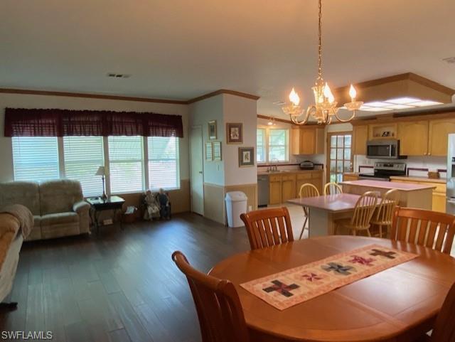 298 Riverwood Road Naples, FL 34114 - Photo 15 of 39 a living room with furniture and a large window