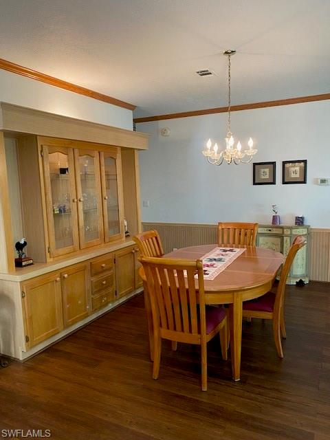 298 Riverwood Road Naples, FL 34114 - Photo 17 of 39 a view of a dining room with furniture wooden floor and chandelier