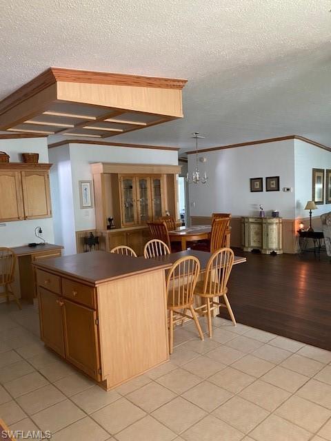 298 Riverwood Road Naples, FL 34114 - Photo 21 of 39 a kitchen with furniture and a table