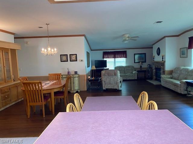 298 Riverwood Road Naples, FL 34114 - Photo 22 of 39 a dining room with furniture and chandelier