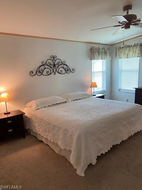 298 Riverwood Road Naples, FL 34114 - Photo 23 of 39 a spacious bedroom with a bed and a window