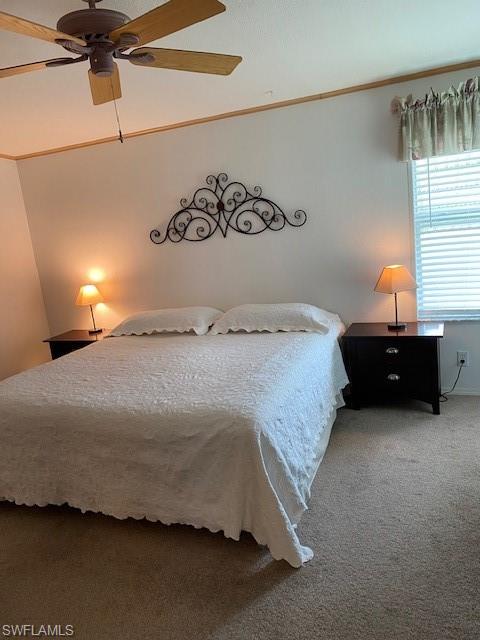 298 Riverwood Road Naples, FL 34114 - Photo 24 of 39 a bedroom with a bed and window