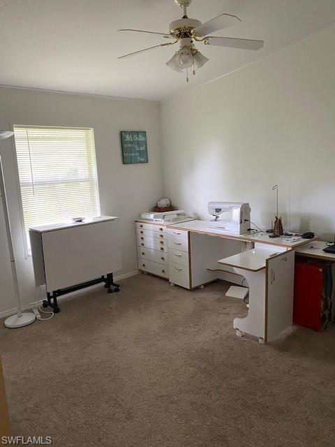 298 Riverwood Road Naples, FL 34114 - Photo 29 of 39 a room with a desk and gym equipment