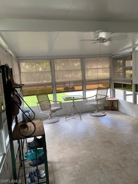 298 Riverwood Road Naples, FL 34114 - Photo 31 of 39 a room with lots of furniture and windows