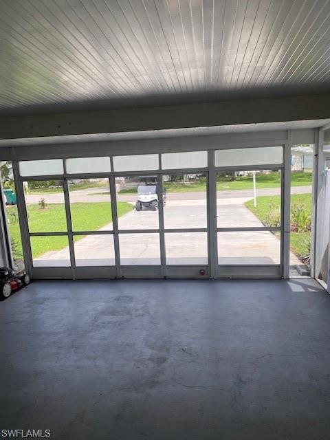 298 Riverwood Road Naples, FL 34114 - Photo 33 of 39 a view of an empty room with a window
