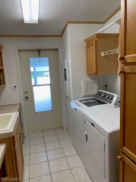 298 Riverwood Road Naples, FL 34114 - Photo 35 of 39 a kitchen with a sink cabinets and a stove top oven