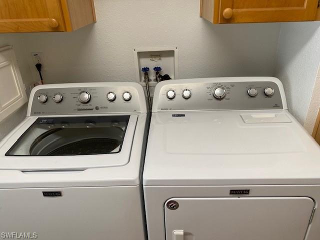 298 Riverwood Road Naples, FL 34114 - Photo 36 of 39 a close up view of washer and dryer