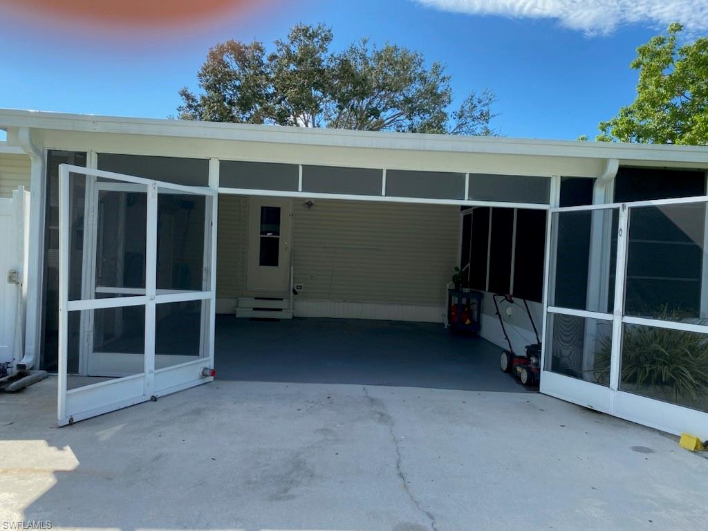 298 Riverwood Road Naples, FL 34114 - Photo 5 of 39 a view of an empty room with a balcony