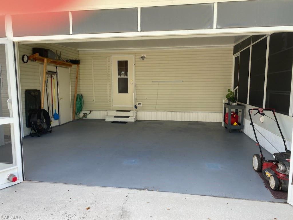 298 Riverwood Road Naples, FL 34114 - Photo 7 of 39 a view of front door and car parked
