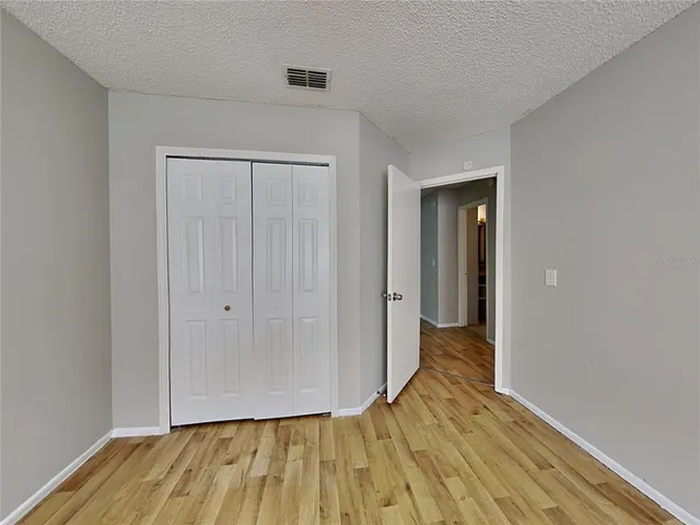 a view of wooden floor in an empty room