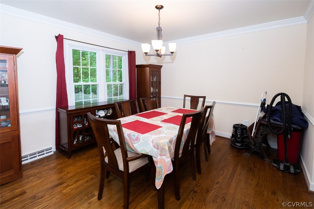 7110 Barkbridge Road Chesterfield, VA 23832 - Photo 13 of 34 a view of a dining room with furniture window and wooden floor