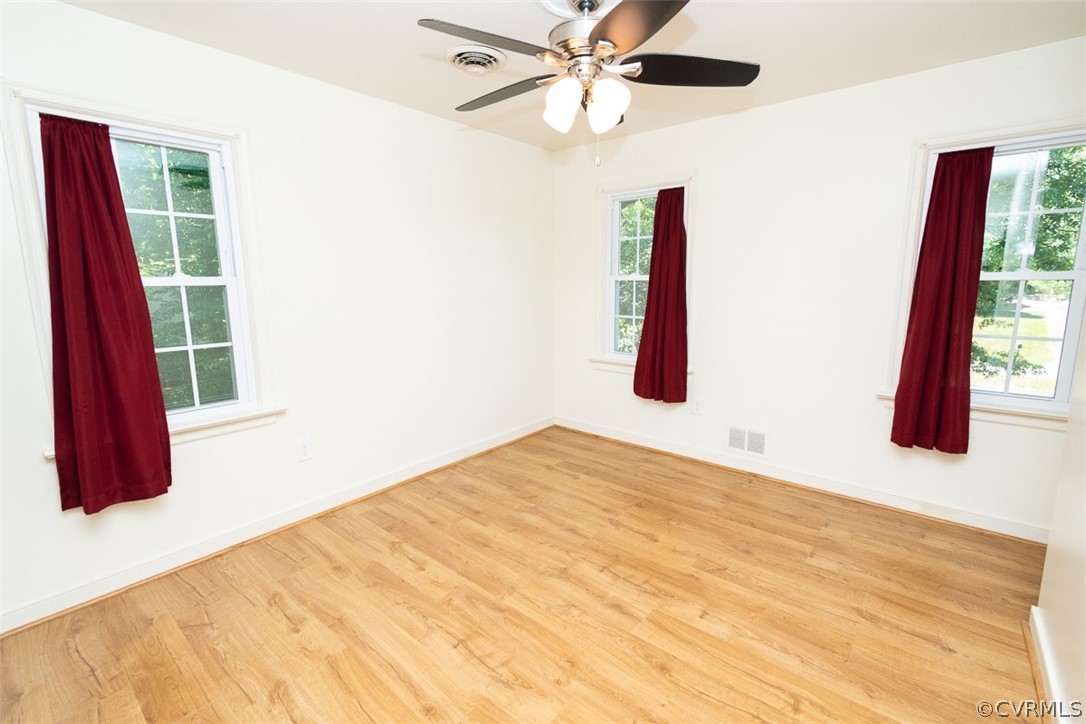 7110 Barkbridge Road Chesterfield, VA 23832 - Photo 25 of 34 a bedroom with a large bed and a large window