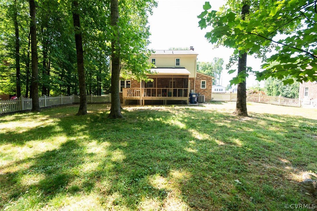 7110 Barkbridge Road Chesterfield, VA 23832 - Photo 33 of 34 a view of a garden with a bench and trees