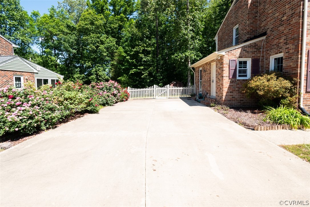 7110 Barkbridge Road Chesterfield, VA 23832 - Photo 5 of 34 a view of a house with a yard and potted plants