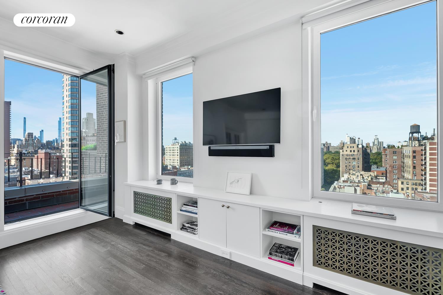 1220 Park Avenue, Unit 13D Manhattan, NY 10128 - Photo 13 of 19 a view of living room with furniture and flat screen tv