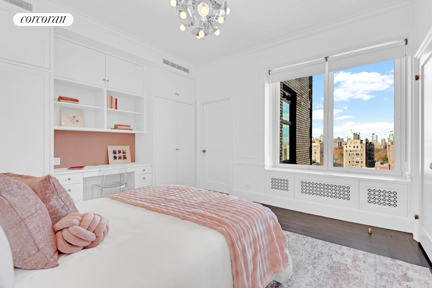 1220 Park Avenue, Unit 13D Manhattan, NY 10128 - Photo 15 of 19 a bedroom with a large bed and a window