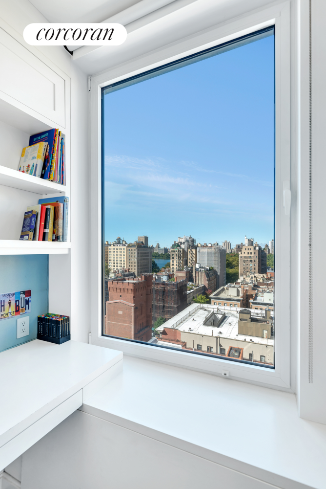 1220 Park Avenue, Unit 13D Manhattan, NY 10128 - Photo 17 of 19 a view of a living room and a floor to ceiling window