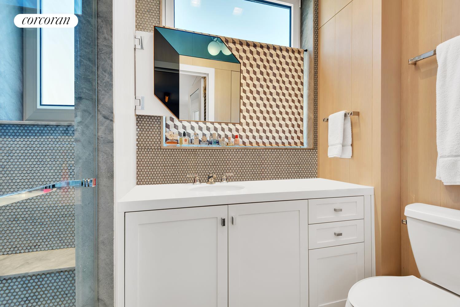 1220 Park Avenue, Unit 13D Manhattan, NY 10128 - Photo 18 of 19 a bathroom with a sink and a toilet