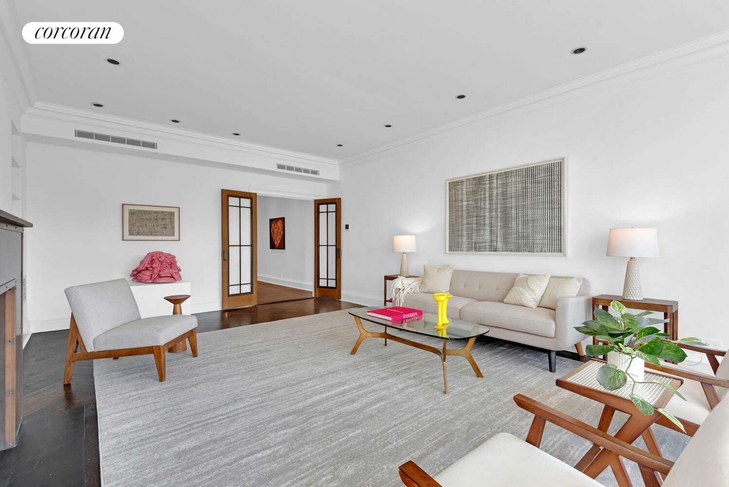 1220 Park Avenue, Unit 13D Manhattan, NY 10128 - Photo 4 of 19 a living room with furniture and wooden floor