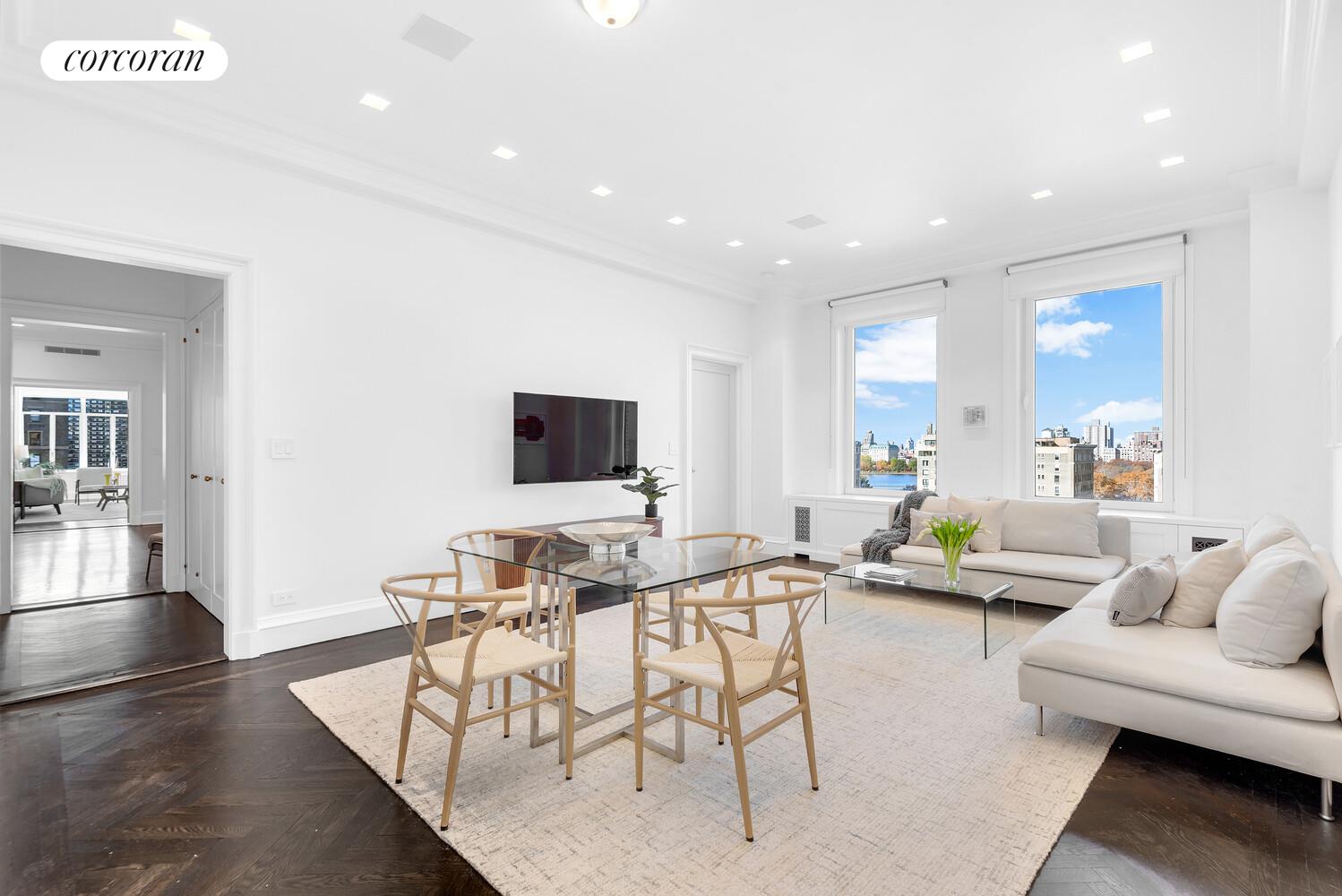 1220 Park Avenue, Unit 13D Manhattan, NY 10128 - Photo 6 of 19 a living room with furniture and a flat screen tv