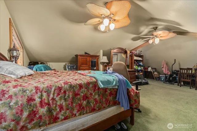 a bedroom with a bed a chandelier and closet