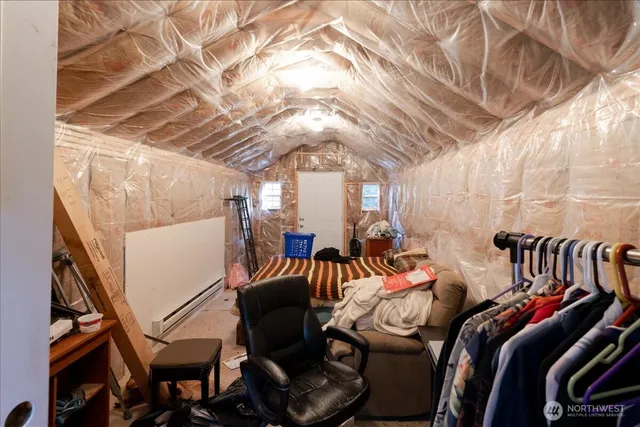 a bed room with a bed and a chandelier