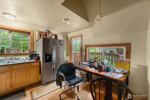 a view of a dining room with furniture window and outside view