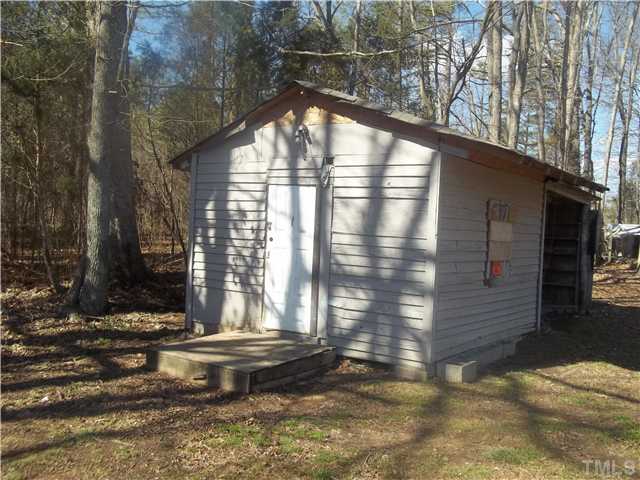 3261 Virgilina Road Roxboro, NC 27574 - Photo 8 of 9 a view of house with a yard