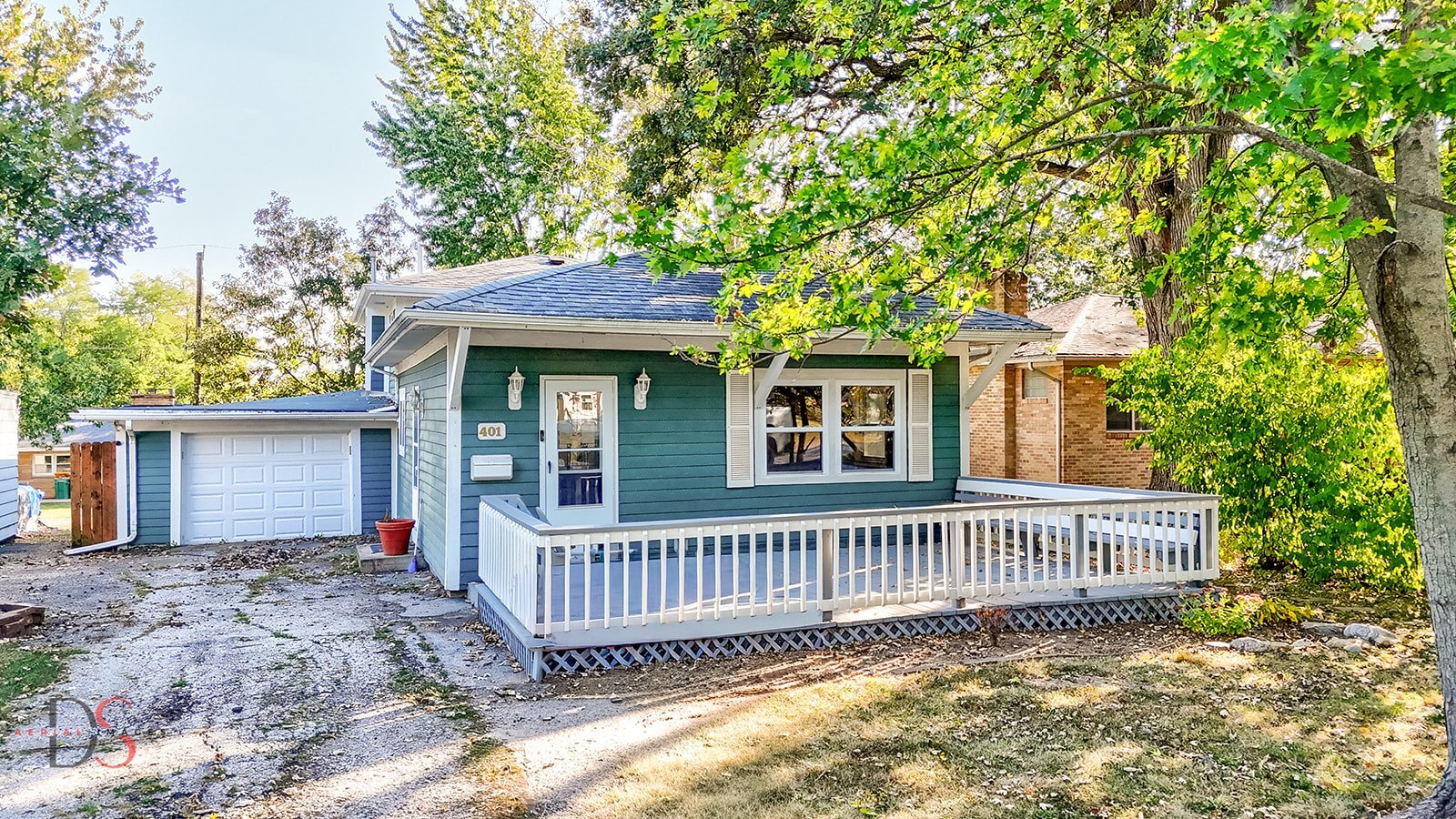 401 Scott Street Marseilles, IL 61341 - Photo 1 of 28 a view of a house with a deck and a yard