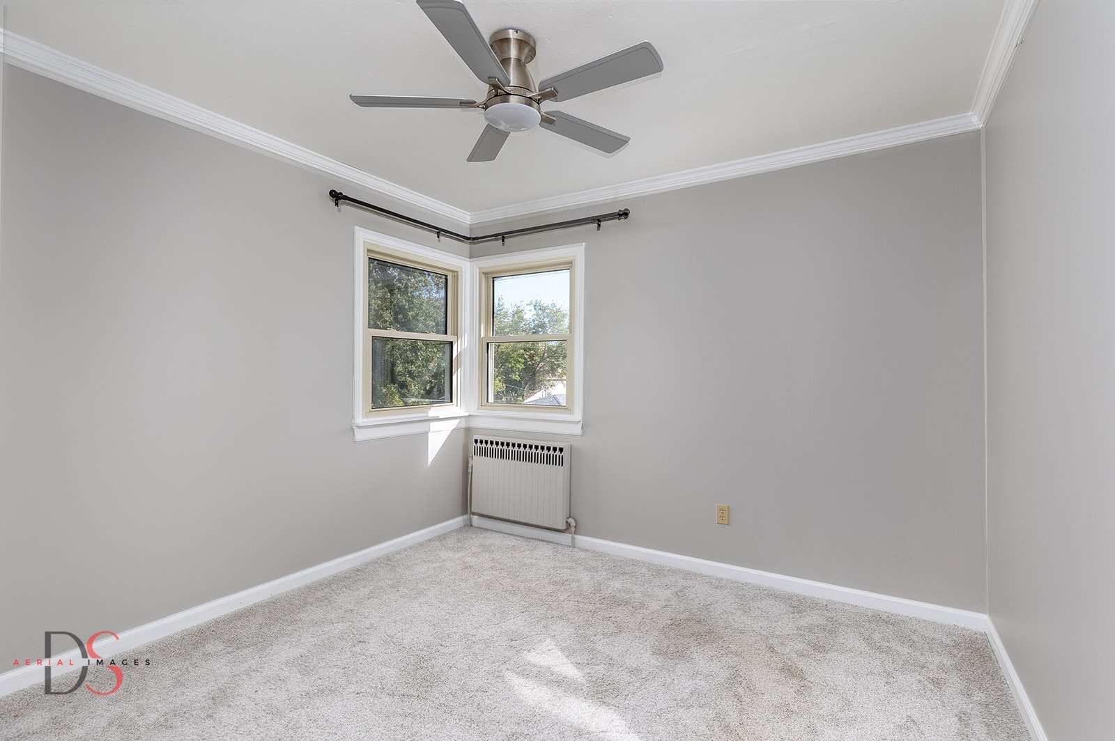 401 Scott Street Marseilles, IL 61341 - Photo 12 of 28 an empty room with a window and a fan