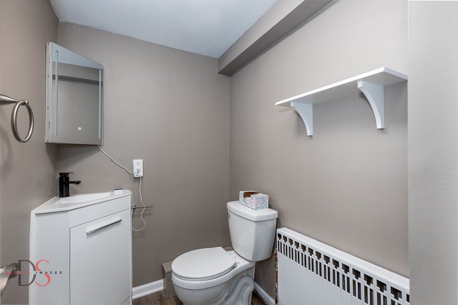 401 Scott Street Marseilles, IL 61341 - Photo 18 of 28 a white toilet sitting next to a bathroom sink