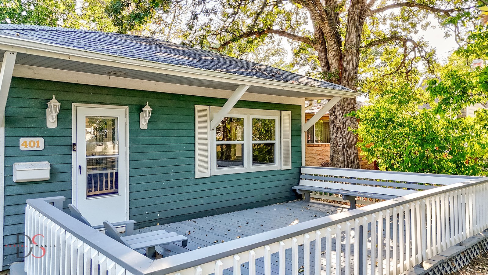 401 Scott Street Marseilles, IL 61341 - Photo 3 of 28 a view of a house with a small yard and wooden fence