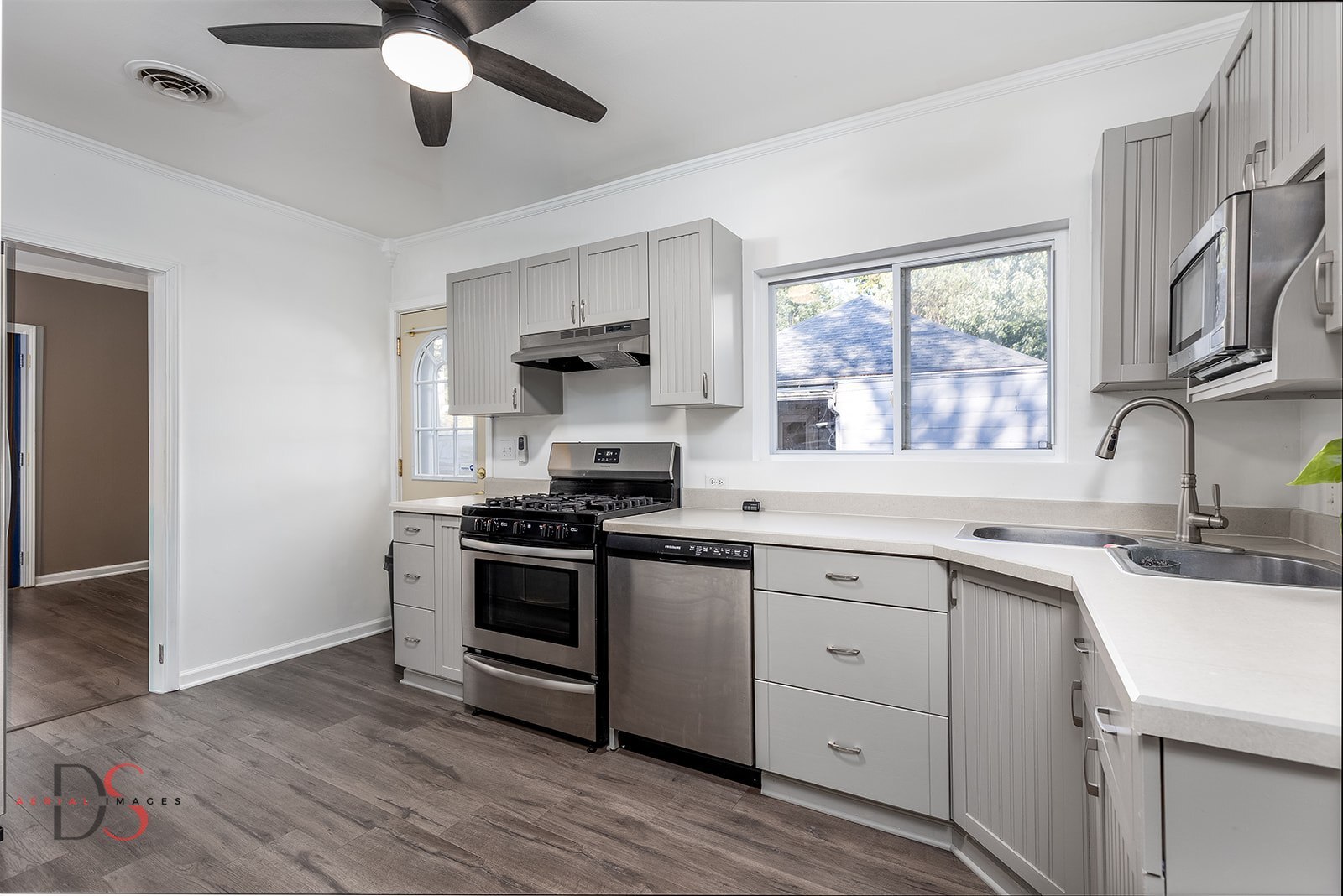401 Scott Street Marseilles, IL 61341 - Photo 6 of 28 a kitchen with a sink appliances wooden floor and a window