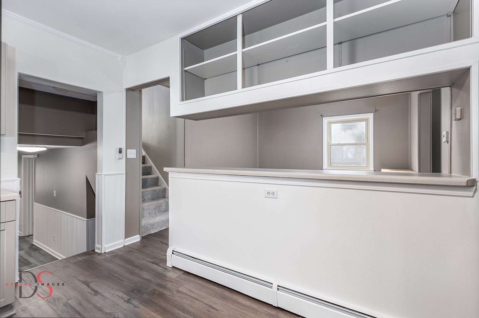 401 Scott Street Marseilles, IL 61341 - Photo 7 of 28 a view of an empty room with wooden floor and a window