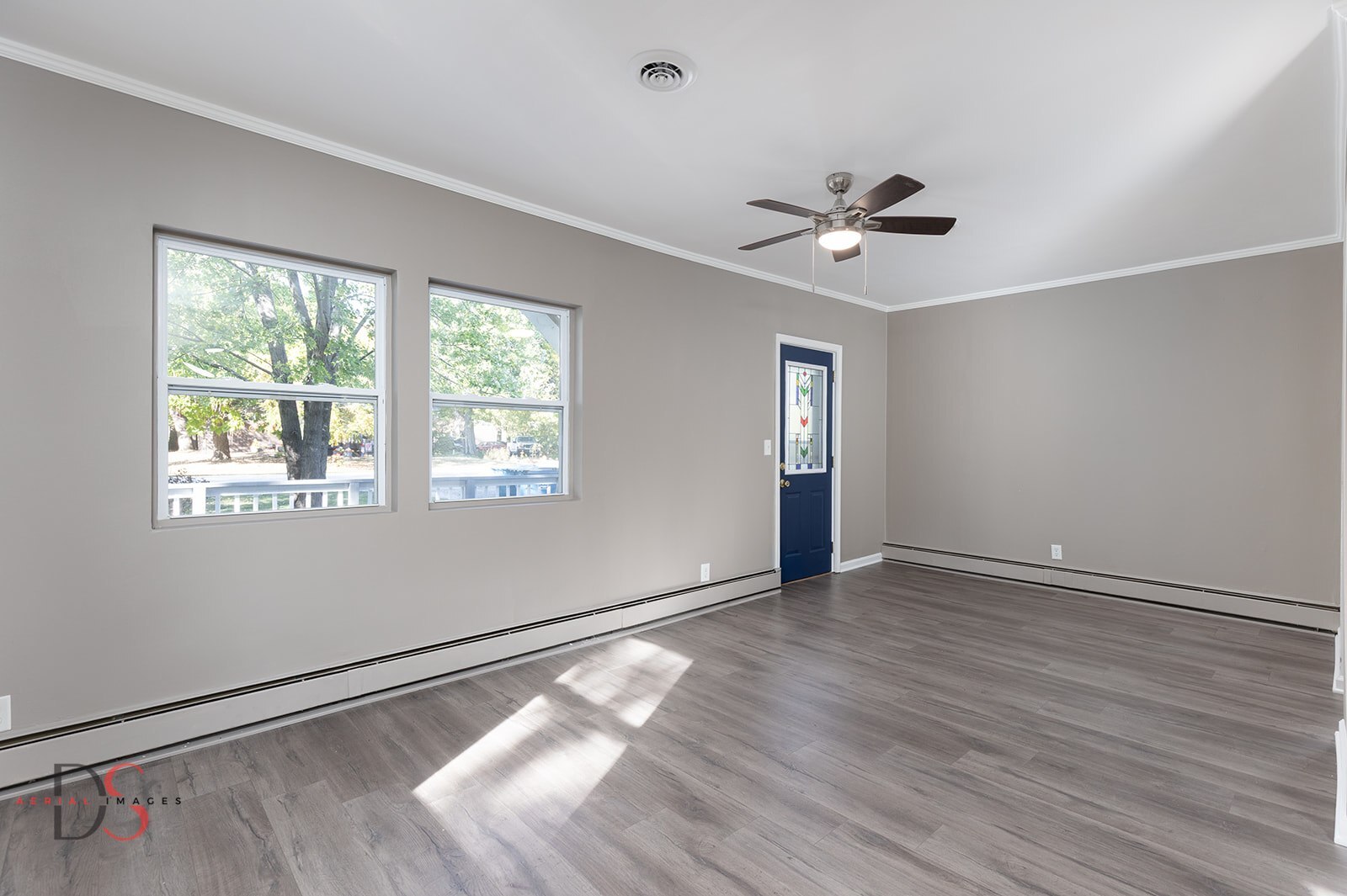 401 Scott Street Marseilles, IL 61341 - Photo 10 of 28 a view of an empty room with a window and wooden floor
