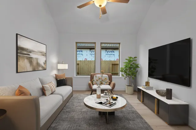 a living room with furniture and a flat screen tv