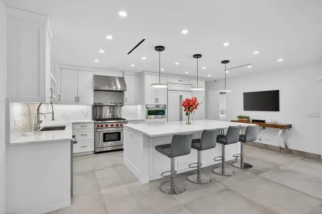 a front view of a house with a yard and a garage