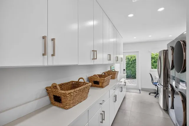 an aerial view of a house with backyard space and sitting space