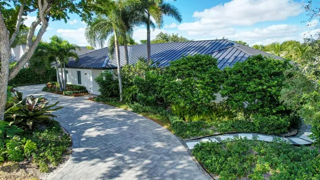 a bedroom with bed and sliding window