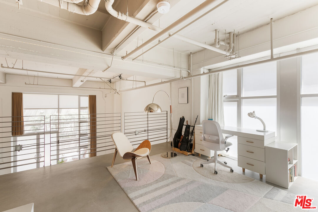 1130 Flower Street, Unit 103 Los Angeles, CA 90015 - Photo 15 of 23 a living room with furniture and a large window